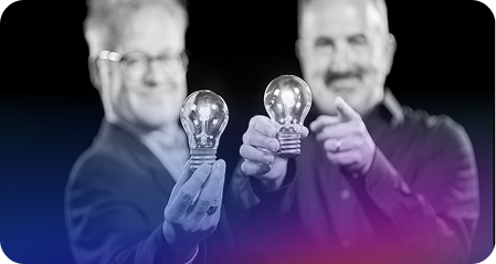 Giving Agency consultant Bob and Mike each holding a light bulb